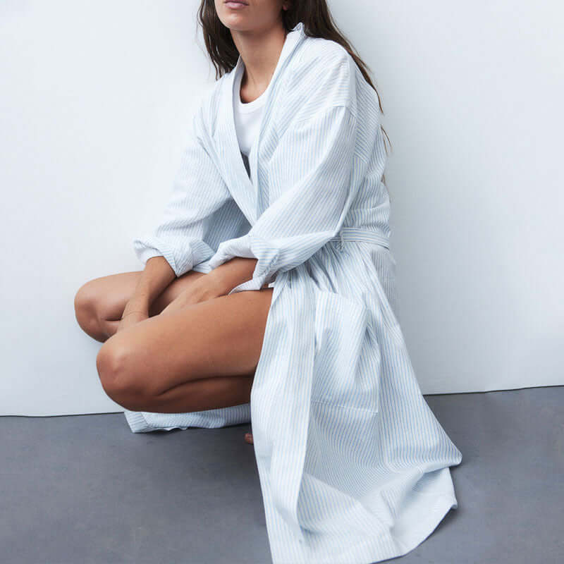 Model wearing the Mutini Soft Stripes robe, showcasing its lightweight and elegant design.