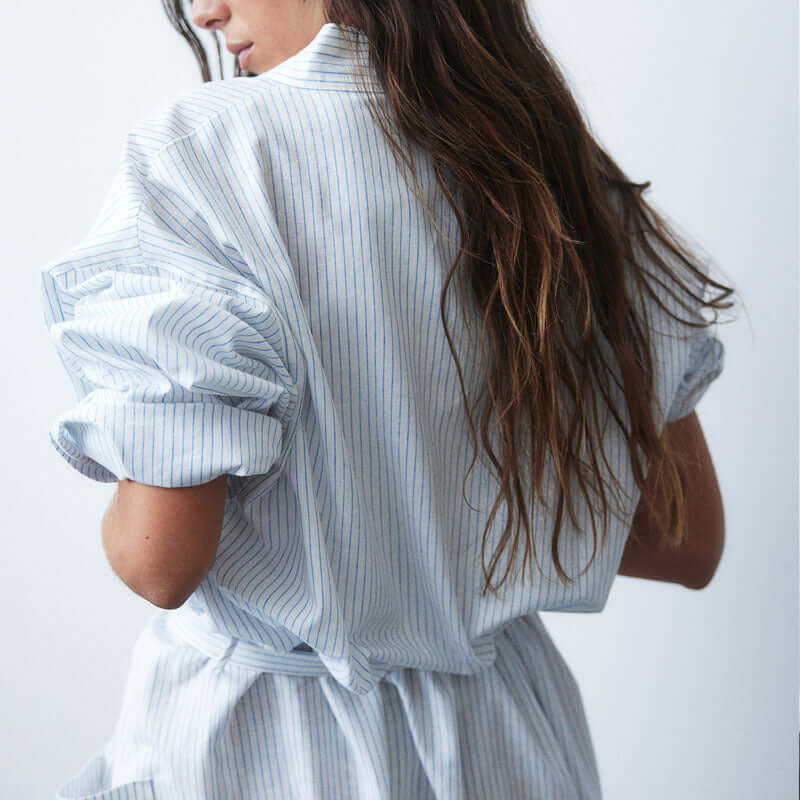 Model wearing Mutini Soft Stripes Robe showcasing lightweight fabric and elegant design from the back.