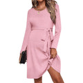 MUTINI™ Luxe Maternity Midi Dress in pink, long sleeve with adjustable tie-waist for expecting mothers.