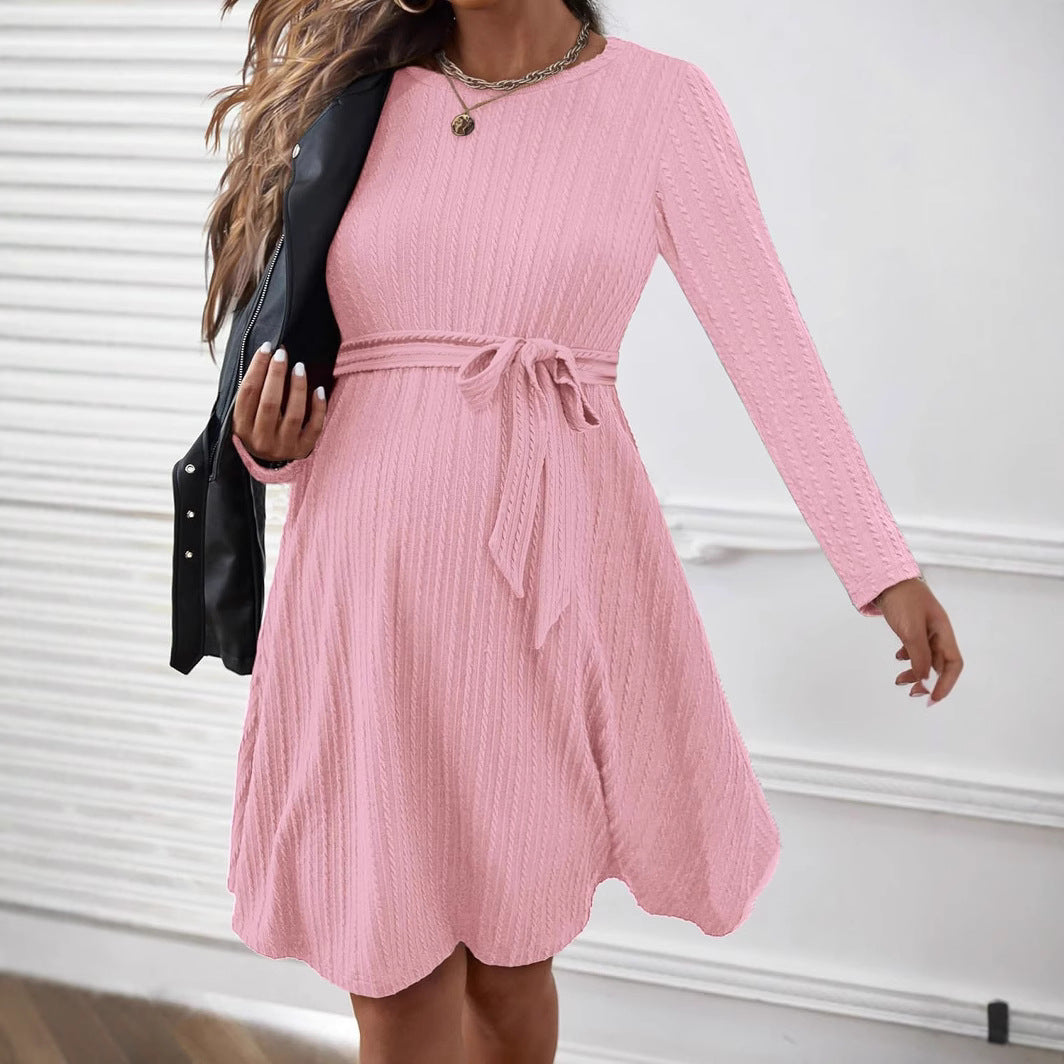 MUTINI™ Luxe Maternity Midi Dress in pink with long sleeves and adjustable tie-waist for expecting mothers.